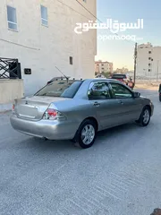  17 ميتسوبيشي لانسر فحص كامل 1600اصلي ولا ملاحظه موديل 2009 اوتوماتيك بوضع الشركه وارد الكويت مالك واحد