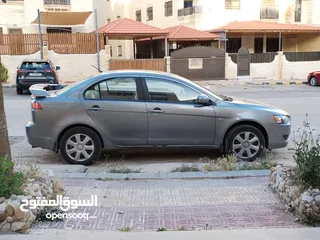  2 ميتسوبيشي لانسر ماشية أقل من 100 ألف كيلو بحالة ممتازة معها مفتاحين و عجل أصلي