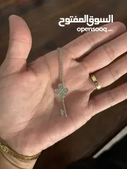  3 Swarovski key necklace - worn once. In very good condition.