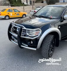  2 ميتسوبيشي L200فحص كامل  داخليه وكاله