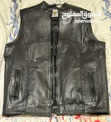  4 Original leather Biker’s vest and various helmets