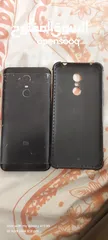  1 Redme note 5 plus black with headphones and a cover