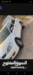  1 لانسر موديل 2010  لونها ابيض