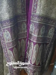  14 مانطو اسود ورمادي وهاد يلي بلصورة وعدة اشياء وفي تنتين مو ديلهم متل العباءة سحاب