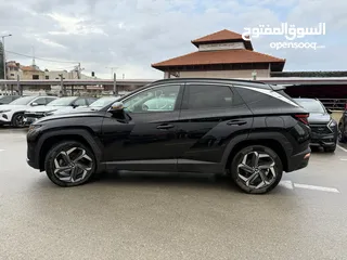  18 هونداي توسان ترخيص 2022 محرك 1600 هايبرد plug in/يقطع على الشحنه 65 كيلو متر  جير أوتوماتيك