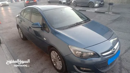  1 أوبل أسترا 2015 أوتاماتيك ماتور 1400 سي سي تيربو فتحة بالسقف لون أزرق