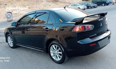  29 متسوبيشي لانسر فراشة موديل 2015 فحص مرفق مع الصور بحالة الوكاااااالة  ماشية 49 الف km  أصلي