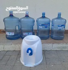  1 Four empty water bottles and coler.anybody interest please contract me.