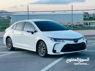  2 تيوتا كورولا هايبرد ترخيص 2022 فل بدون فتحة مميزة  ماتور 1800cc ( بنزين + كهرباء) 170Hp