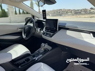  11 تويوتا كورولا 2020 هايبرد لون اسود حره باسم المستورد