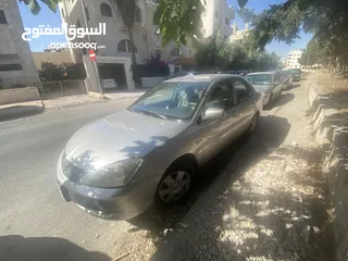  16 ميتسوبيشي لانسر موديل 2010 محرك 1300 سي سي ..الفحص مرفق بالصور
