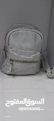  1 silver shiney bagpack for kids