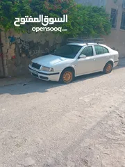  2 سكوده اكتافيه موديل 2002 ديزل جير عادي اصل عمومي لون ابيض مطور 1900 جير ومطور شغلات ميه ميه