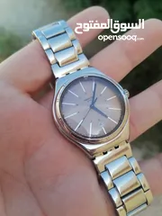  1 #SWATCH  سواتش سويسري اصلي لومينوس شباك للتاريخ  حجم 41 بحالة ممتازه  40 دينار