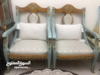  4 A seating set made of wood ,  consisting of two chairs and sofa
