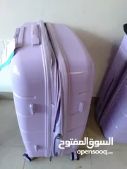  2 purple suitcase used once