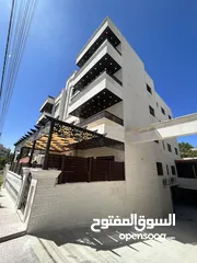  21 اخر شقة بالاقساط طابق ثاني في اجمل مناطق تلاع العلي باطلاله على شارع الجامعه