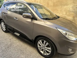  6 2009 ‏Hyundai توسان LX20 اربع ابواب، اللون فيراني، الكراسي جلد والسيارة 92,000 كيلو فقط وبحالة رائعة