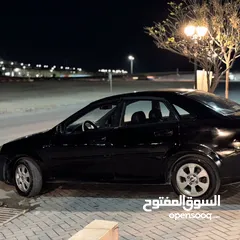  12 شيفروليه اوبترا 2009 اسود 1600cc