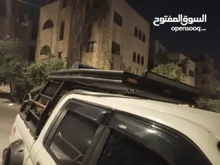  14 رول بار مع سلة وشبك (غرفة شبك) لبك اب ميتسوبيشي من موديل 2000 ولغاية 2006 بحالة الوكاله