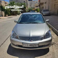  1 لانسر رالي ارت 2007 السيارة معمولها صيانه كامله من شهرين مع دهان ومش محتاجه شي بالصلاه ع النبي 