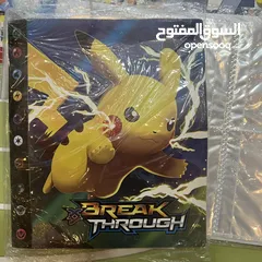  8 كروت بوكيمون والبومات (Pokemon cards and binders)