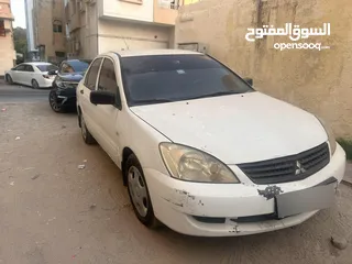  2 سيارة لانسر 2012 جدا نضيفة السيارة مفحوصة