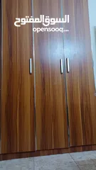  1 wooden 3 door cupboard