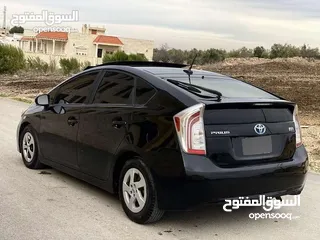  10 تويوتا بريوس 2015 هايبرد فل كامل مع بانوراما أعلى صنف بكج ( 5) لون اسود مميز
