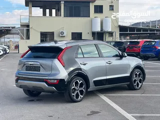  7 كايا نيرو  هايبرد (بنزين+كهرباء ) فل الفل  فتحة سقف  لون مميز اضافات مميزة /2022 جناح اسود