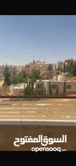  13 Excellent natural light and winds with views of Shafa Badran from the highest level in the building.