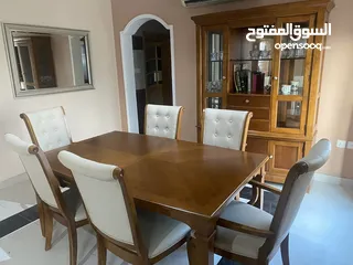  4 Dining set expandable table including cupboard.