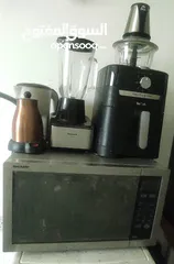  1 ميكرويف، شواية، خلاط، مكواة،مطحنة قهوة وغلاية قهوة كهربائية، سخان ماء، مفرمة لحمة، مكينة فشار2
