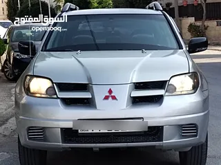  19 ميتسوبيشي آوتلاندر اوتوماتيك 2003 توب نظافة بسعرررر مميززز محرك 2400cc
