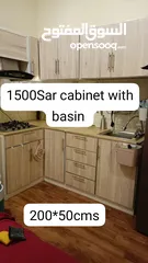  1 cabinets with chimney and stove and basin