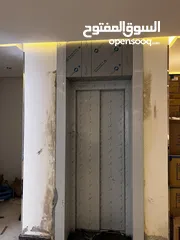  2 تكسيات وتقفيل مصاعد أستيل  رخام بديل خشب بديل رخام شيبورد