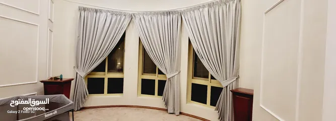  18 Quality House curtains and sofa