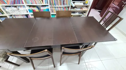  4 Good quality dining table and 7 chairs