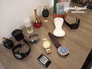  19 مجموعه عطور ستاتي وساعات رجالي اصليه  و كوبي ون +ساعة الحرمين جديده..للبيع في اربد