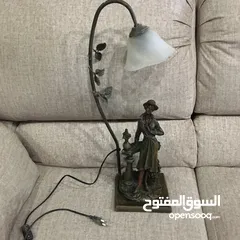  4 تمثال برونزي مع شمعدان فضة