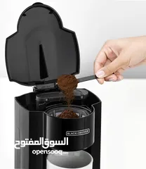  2 الة قهوة مع كوب ابيض للقهوة