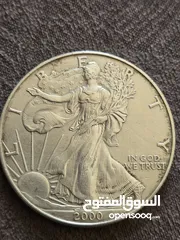  1 اونصه فضه/ عمله نص دولار أمريكي