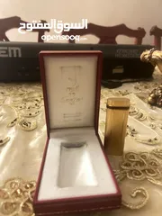  3 Cartier gold plated lighter vintage 1983.  ولاعة كارتييه مطلية بالذهب، طراز 1983