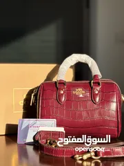  1 شنطة كوتش برغندي لميع 18 سم