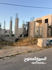  2 ارض عليها تلات مخازن قيد الانشاء للبيع في بيت كاحل الشارع الرئيسي شارع المنتزهات