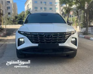  1 هونداي توسان ( هايبرد)  بنزين + كهرباء  فل الفل اضافات