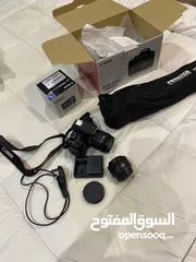  1 كاميرا كانون 850d وعدسه 50mm وستاند تصوير