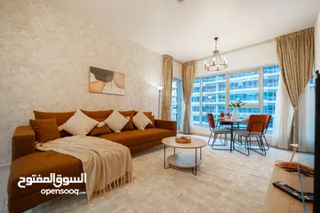  18 دبي لاند SKYCOURT  غرفة وصالة  مفروشة  سوبرلوكس مع بلكونه-إيجار شهري شامل