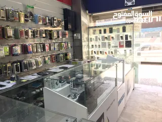  12 محل تجاري للبيع مجهز كامل موقع مميز ملاصق لمعرض شركة زين - شارع باب الواد - الوسط التجاري/ الزرقاء