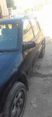  4 كيا سبورتاج موديل 2000 لون كحلي